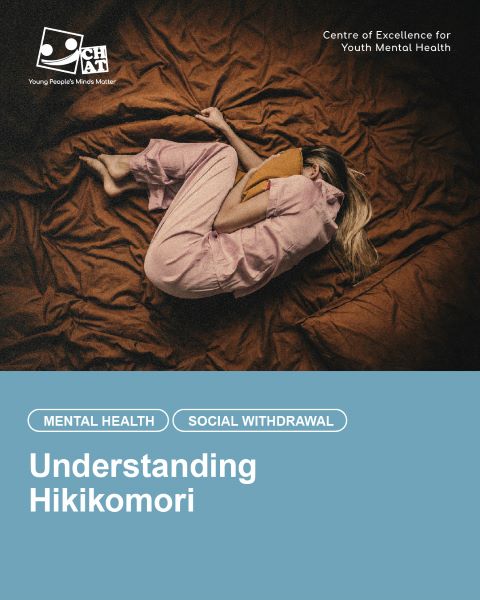 Top view of a female young person covering her head with a pillow on a bed, expressing fear and solitude, representing Hikikomori